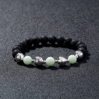 Glowing Faith Bracelet – Black Volcanic Stone with Luminous Beads & Metal Accents (Unisex)
