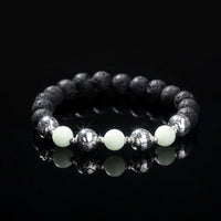 Glowing Faith Bracelet – Black Volcanic Stone with Luminous Beads & Metal Accents (Unisex)