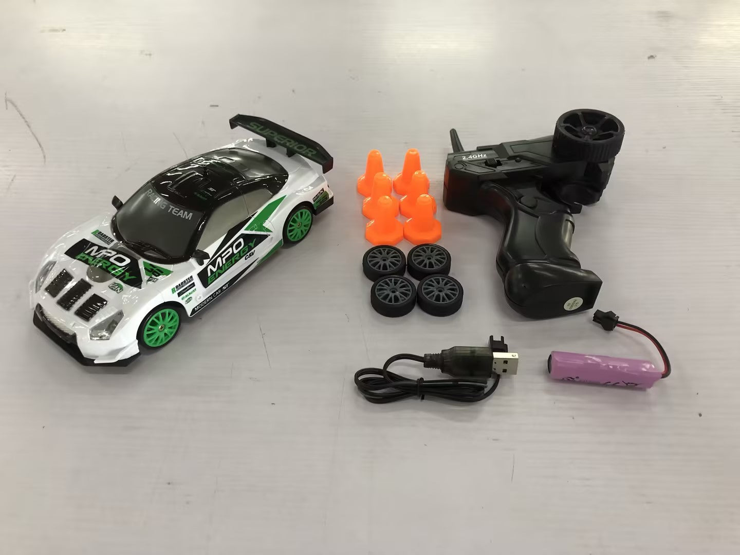 2.4GHz 1:24 4WD RC Drift Car with LED Lights – High-Speed Remote Control Racing Car for Kids (Rechargeable, Cones Included) What Else You Got?
