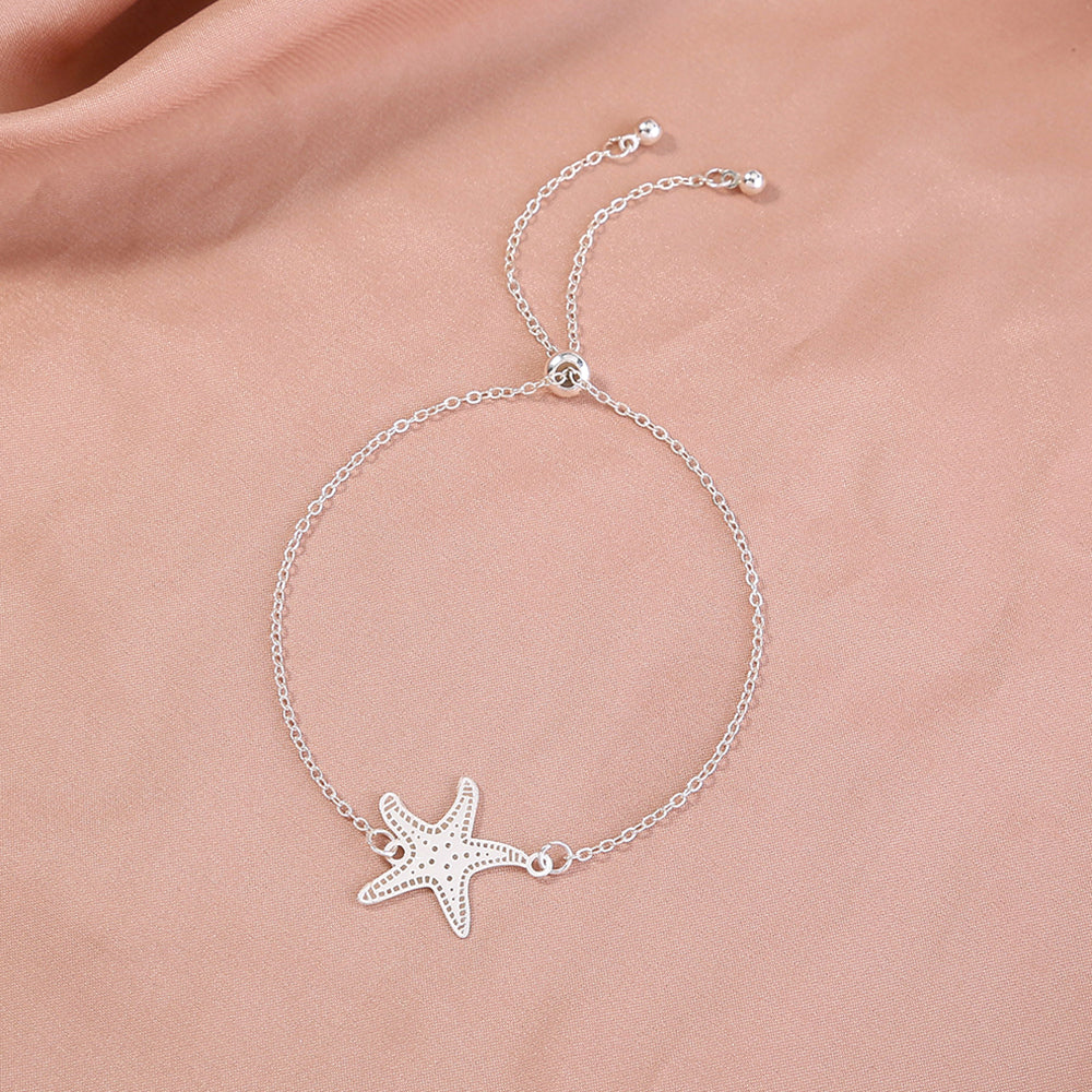 Silver starfish, glow-in-the-dark shrink bracelet What Else You Got?