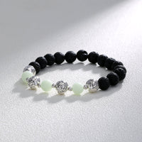 Glowing Faith Bracelet – Black Volcanic Stone with Luminous Beads & Metal Accents (Unisex)