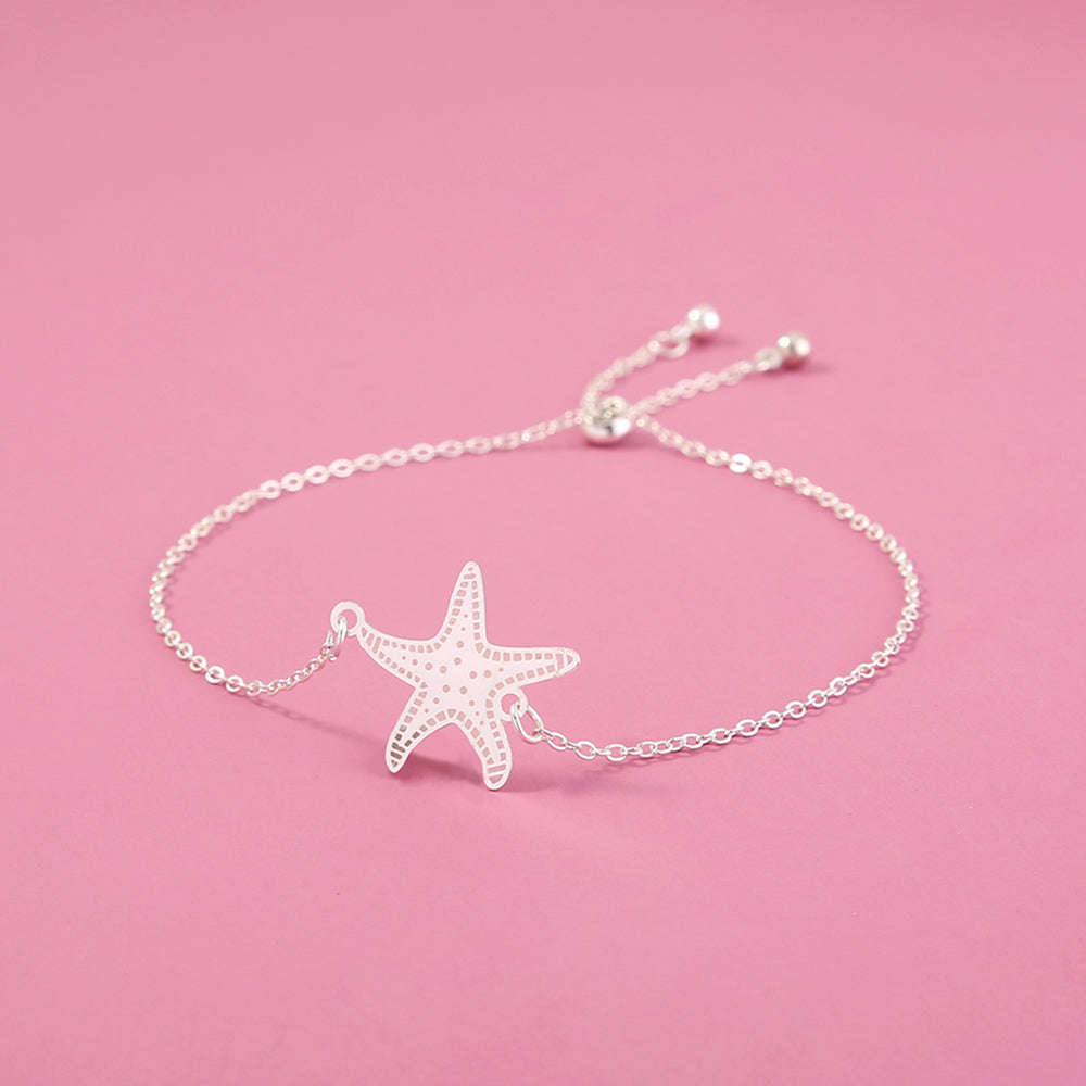 Silver starfish, glow-in-the-dark shrink bracelet What Else You Got?