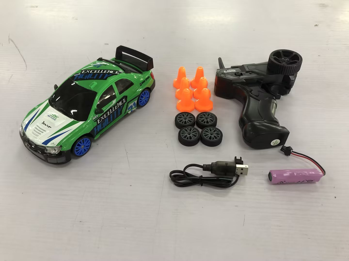 2.4GHz 1:24 4WD RC Drift Car with LED Lights – High-Speed Remote Control Racing Car for Kids (Rechargeable, Cones Included) What Else You Got?