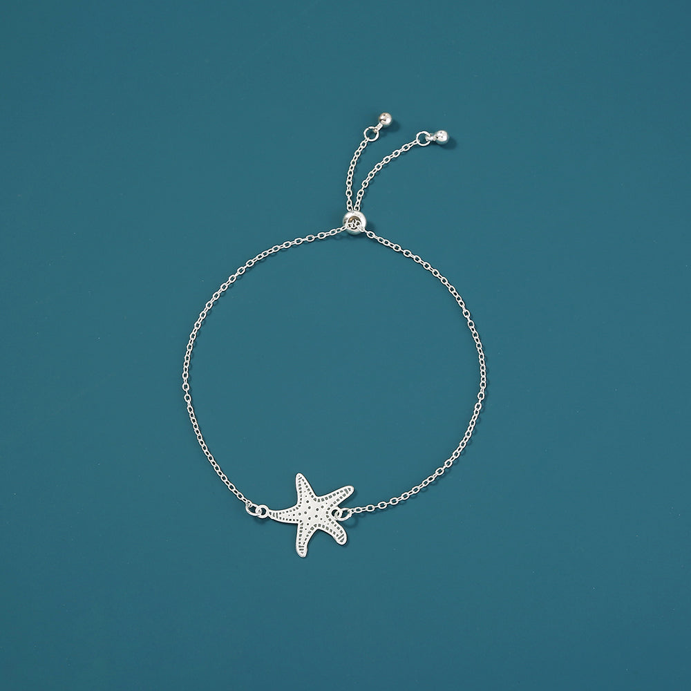 Silver starfish, glow-in-the-dark shrink bracelet What Else You Got?