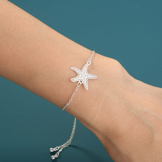 Silver starfish, glow-in-the-dark shrink bracelet What Else You Got?