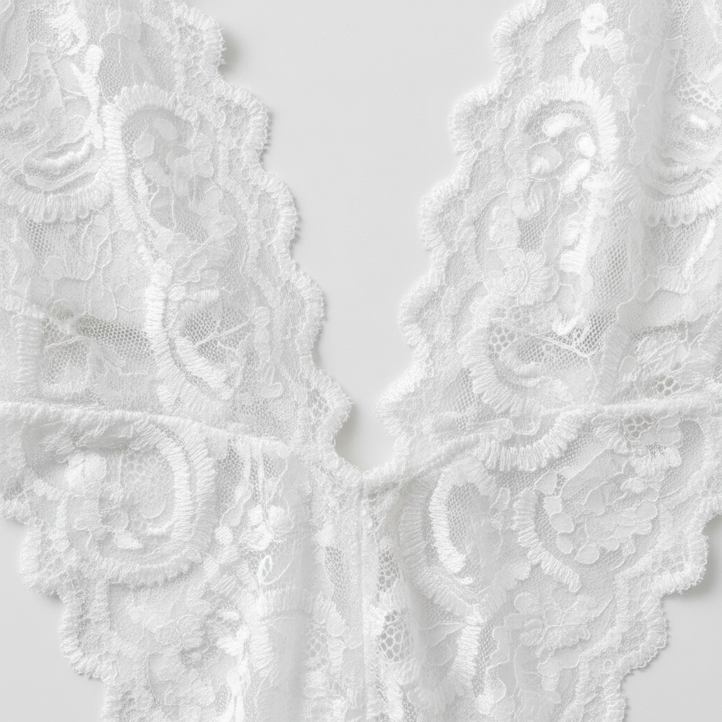 Close-up of delicate lace fabric on backless lingerie set