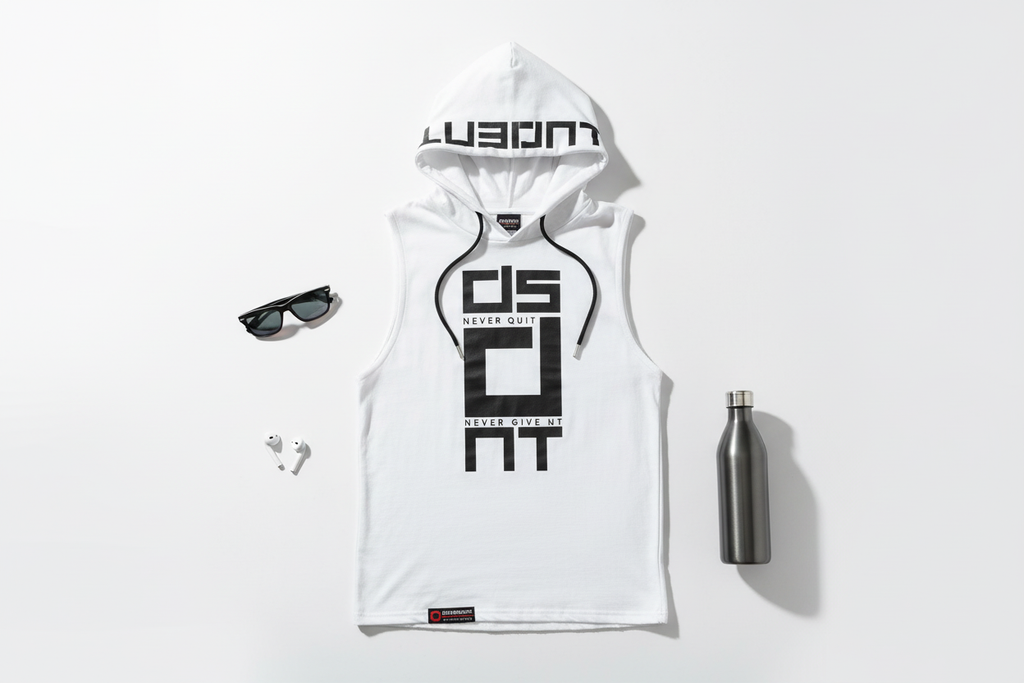 Flat lay of men's sleeveless hoodie vest with summer accessories on white background